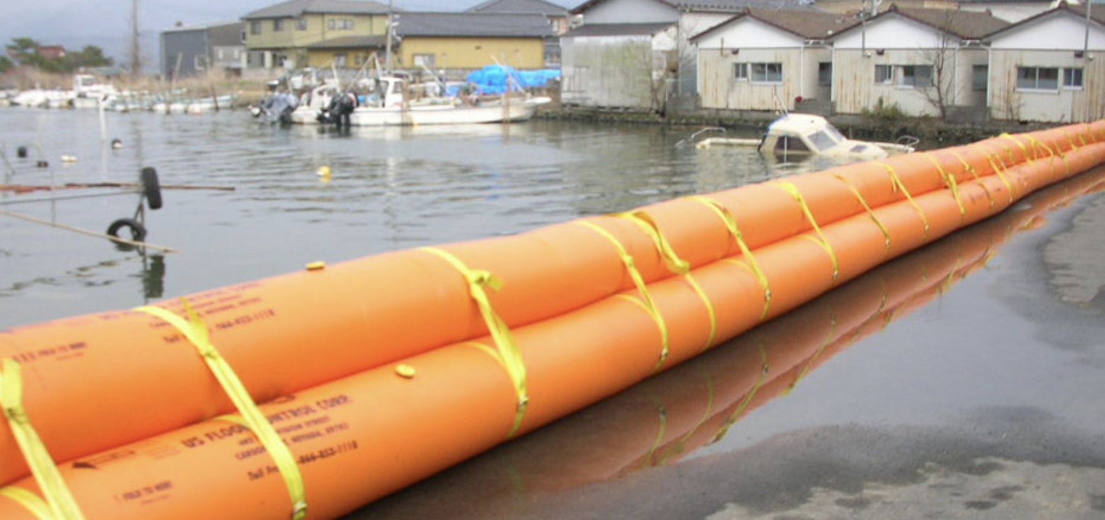 Tiger Dam flood barrier deployed along a river